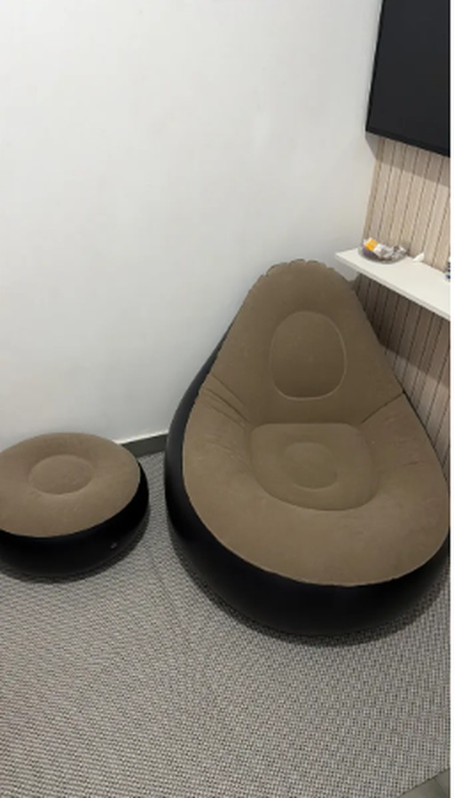 Customer photo showing the inflatable lounge chair with ottoman on a balcony
